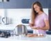 young-happy-smiling-woman-preparing-toasts-breakfast-kitchen-home-early-morning_122732-2807
